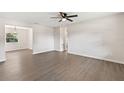 Spacious living room with gray flooring, offering a versatile space with great natural light and an open layout at 2106 Umbrella Tree Dr, Edgewater, FL 32141