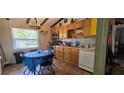 Functional kitchen with stainless steel appliances and adjacent dining area at 27751 Luella Ave, Paisley, FL 32767