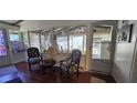 Relaxing sunroom with classic furniture and bright, natural lighting at 27751 Luella Ave, Paisley, FL 32767