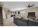 Open-concept living room featuring tile floors, a ceiling fan, and seamless flow to the kitchen at 2916 Meleto Blvd, New Smyrna Beach, FL 32168