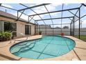 Relaxing screened in pool with blue tile accents and a spacious deck, perfect for outdoor enjoyment at 2980 Lockwood Blvd, Deltona, FL 32738