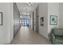Hallway with elevator access and bright windows to the oceanfront at 2987 S Atlantic # 1403, Daytona Beach Shores, FL 32118