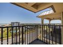 Balcony view looking out onto a coastal community with mature palm trees at 3170 Ocean Shore Blvd # 5010, Ormond Beach, FL 32176