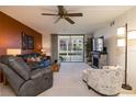 Inviting living room with a fireplace, comfortable seating, and sliding glass doors to the balcony at 325 Wilder Blvd # A102, Daytona Beach, FL 32114