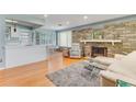 Bright, open living room with fireplace, hardwood floors and a dining area at 355 Hartford Ave, Daytona Beach, FL 32118