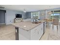 Open concept kitchen with granite countertops, stainless steel sink and ample counter space at 460 Sarah Nicole Way, New Smyrna Beach, FL 32168