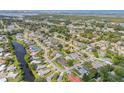 Neighborhood featuring neatly kept homes, green spaces, water, and a view of the city in the distance at 5478 Landis Ave, Port Orange, FL 32127