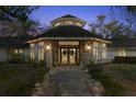 Charming front entrance with stone accents and festive wreaths adding a welcoming touch to the property at 5721 John Anderson Hwy, Flagler Beach, FL 32136