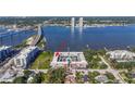 Aerial view of waterfront townhome community, highlighting the pool and bay access at 625 N Halifax Ave # 11, Daytona Beach, FL 32118