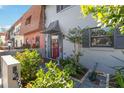 Beautiful landscaped entrance with well-maintained garden, stone pathway, and stylish front door at 625 N Halifax Ave # 11, Daytona Beach, FL 32118