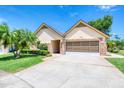 Beautiful home with a two-car garage, complemented by a well-kept lawn at 706 Fox Tail Ct, New Smyrna Beach, FL 32168
