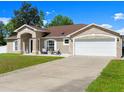 Well maintained home featuring a spacious driveway and inviting front porch at 2600 Scottville Ave, Deltona, FL 32725