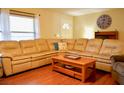 Cozy living room featuring a large sectional sofa and a wooden coffee table at 1010 Hanford Dr, Deltona, FL 32738