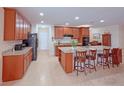 Spacious kitchen featuring a large center island, granite countertops, and ample cabinet space at 110 No Name Key Dr, Deland, FL 32720