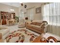 Open-plan space blending living and dining areas under high ceilings with natural light at 1125 Stillwater Dr, Deland, FL 32720