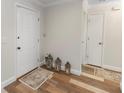 Inviting entryway with wood-look floors, decorative lanterns, and a neutral color palette at 136 W Gardenia Dr, Orange City, FL 32763