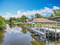 Scenic view of a canal with a private boat dock and lift, perfect for boating enthusiasts at 1520 Stone Trl, Enterprise, FL 32725