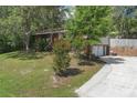 Charming brick two-story home with a well-maintained front yard and mature trees at 2032 Yorkshire Dr, Deland, FL 32724