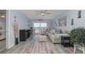 Inviting living room with ocean view, neutral furniture, and coastal decor at 2222 Ocean Shore Blvd # 304B, Ormond Beach, FL 32176