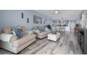 Comfortable living room featuring light blue walls and stylish furnishings at 2222 Ocean Shore Blvd # 304B, Ormond Beach, FL 32176