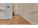 Bright entryway featuring hardwood floors, coat rack, and stairs to the second level at 241 Bayou Vista St, Debary, FL 32713