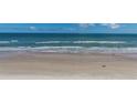 Expansive beachfront view of the ocean, sandy beach, and clear blue sky at 2987 S Atlantic Ave # 903, Daytona Beach, FL 32118