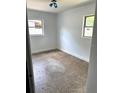 Bedroom features natural light with a classic ceiling light fixture and neutral walls at 3 Cassia Ln, Debary, FL 32713