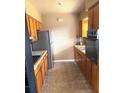 Traditional kitchen with wood cabinets and stainless steel refrigerator at 3 Cassia Ln, Debary, FL 32713