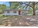 A lovely single-story home featuring a covered carport and a cozy front entrance at 352 Harlan Ave, Lake Helen, FL 32744