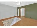 Spacious living room featuring hardwood floors, fresh paint, and a bright, airy atmosphere at 352 Harlan Ave, Lake Helen, FL 32744