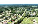 Community aerial view with golf course, water feature and mature landscaping at 438 Harbour Town Ln, Ormond Beach, FL 32174