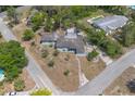 Aerial view of a single story home that shows the surrounding neighborhood and ample lot size at 45 S University Cir, Deland, FL 32724
