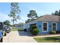 Garage exterior showing a large white door and landscaped area at 4611 Se 32Nd Pl, Ocala, FL 34480