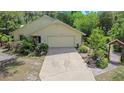 Charming single-story home with lush landscaping at 5635 Burts Park Rd, De Leon Springs, FL 32130