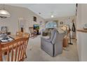 Cozy living room with vaulted ceilings and natural light, great for relaxation and entertainment at 663 E Lansdowne Ave, Orange City, FL 32763