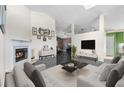 Bright living room with fireplace, modern furnishings, and open floor plan at 809 Brightview Dr, Lake Mary, FL 32746