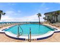 Stunning beachfront pool with lounge seating area and ocean view to enjoy the outdoors at 915 Ocean Shore Blvd # 8010, Ormond Beach, FL 32176
