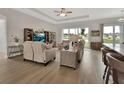 Inviting living room featuring comfortable seating, a large window view, and stylish decor at 1000 Megano Blvd, Deland, FL 32724