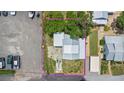 Aerial view of the property showcasing the roof, yard, and surrounding area at 104 N Park Pl, Edgewater, FL 32132