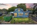Charming blue bungalow with a tidy yard, perfect for a cozy, relaxed living at 104 N Park Pl, Edgewater, FL 32132