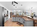 Spacious kitchen with granite countertops, stainless steel appliances, and modern cabinetry at 10800 Crescent Ridge Loop, Clermont, FL 34711