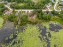 Beautiful aerial view of the home near a lake, showcasing its attractive location and landscaping at 1092 Gage Ave, Deltona, FL 32738