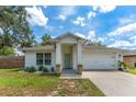 Lovely single-story home with a well-kept lawn, attached garage, and inviting front entrance at 1092 Gage Ave, Deltona, FL 32738