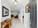 Welcoming foyer with neutral tile flooring leading to a spacious living area at 1444 Daystar Ln, Deltona, FL 32725