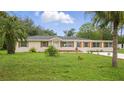 Inviting single Gathering home featuring well maintained landscaping and front yard at 1518 Lakeside Dr, Deland, FL 32720