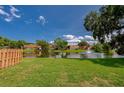 Scenic view of a pond with a fountain from the backyard at 152 Sweetgum Ln, Port Orange, FL 32129