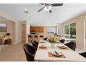 Open concept dining area featuring a view to the kitchen and backyard at 227 Blue Crystal Dr, Deland, FL 32720