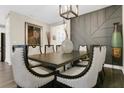Elegant dining room showcases a sleek table, statement chairs, and designer wall accents at 241 Old Moss Cir, Deland, FL 32724