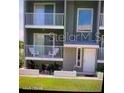 Exterior of condo featuring multi-story balconies and an inviting entrance at 2898 Ocean Shore Blvd # 603, Ormond Beach, FL 32176