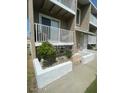 A welcoming condo exterior featuring a private balcony and well-maintained landscaping at 2898 Ocean Shore Blvd # 603, Ormond Beach, FL 32176